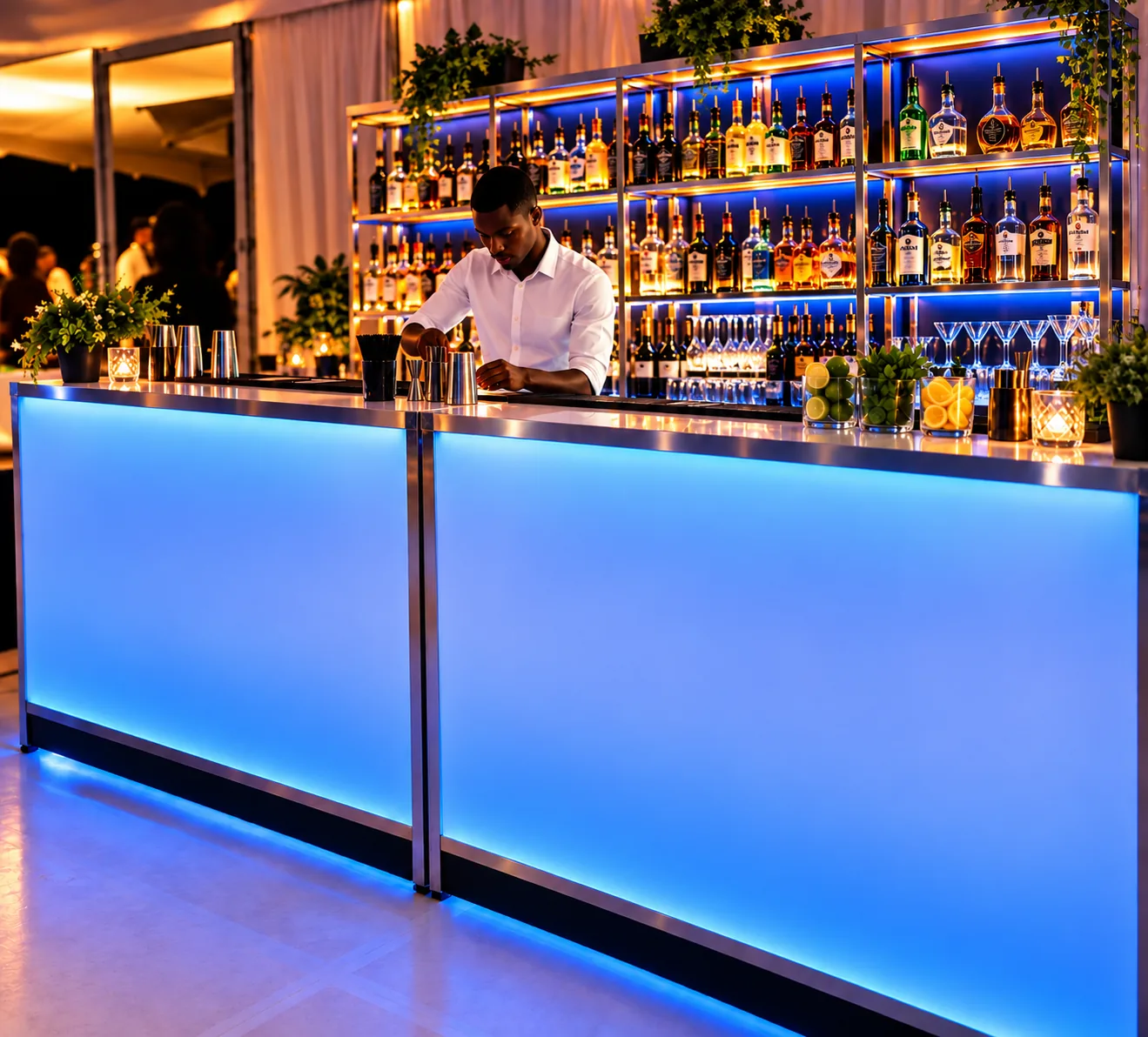Bartender mixing drinks behind a glowing blue mobile bar